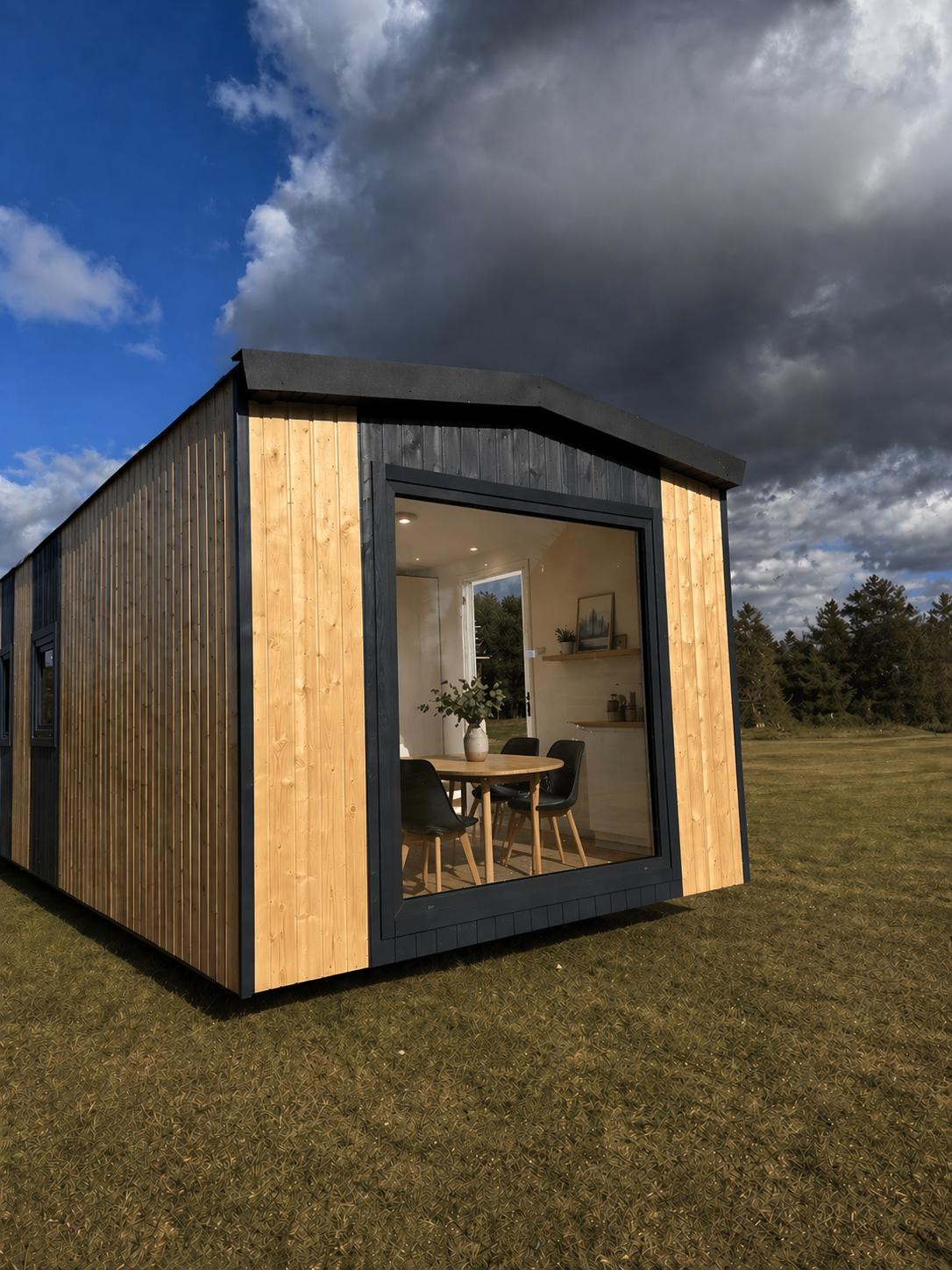 Domek mobilny Nomad Loft od MOBILDOMY, elewacja z dużym oknem